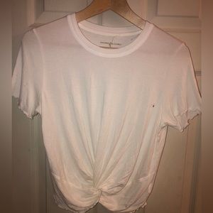 American Eagle white Top. With Ruffles edges. Cropped with a twist